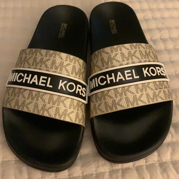Michael Kors Shoes - Brand new Michael Kors slip ons gold & black